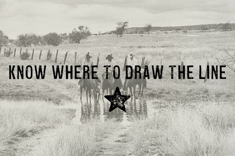 Cowboys watering their horses at a shallow crossing under an open sky.