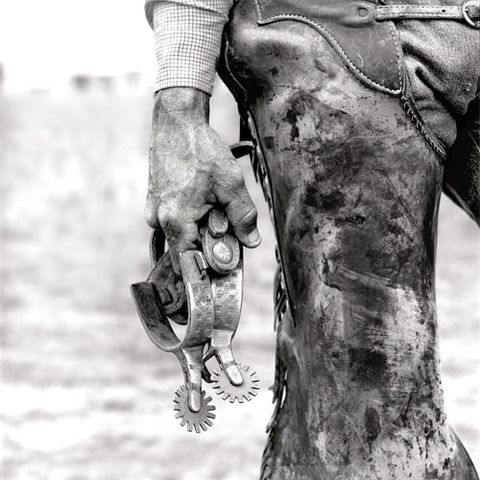 A cowboy's hand resting beside a spur, Means Ranch, Valentine, Texas.